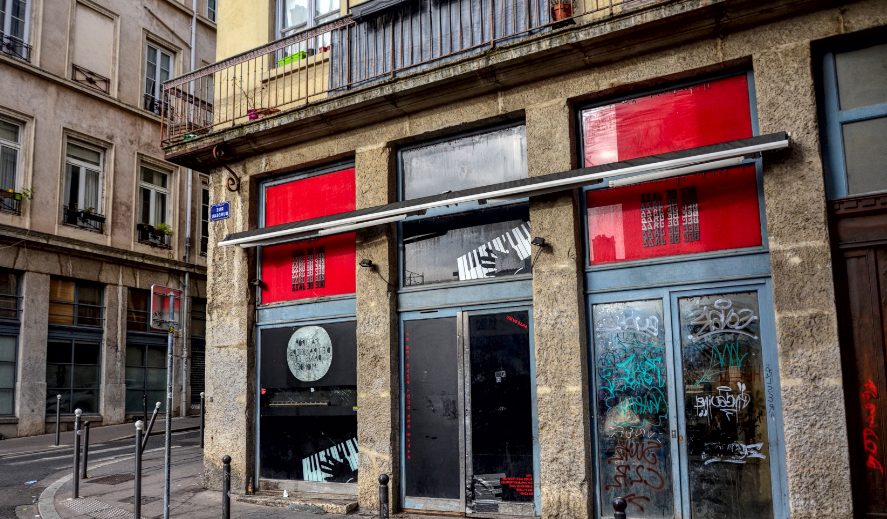 Abandonned facade of an ancient musical instrument store